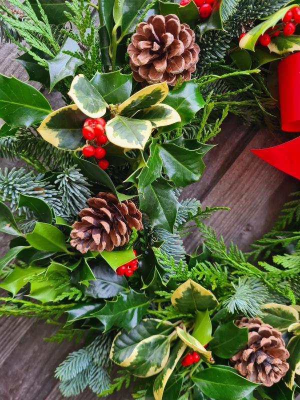 Traditional Holly wreath with cones