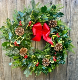 Traditional Holly wreath with cones